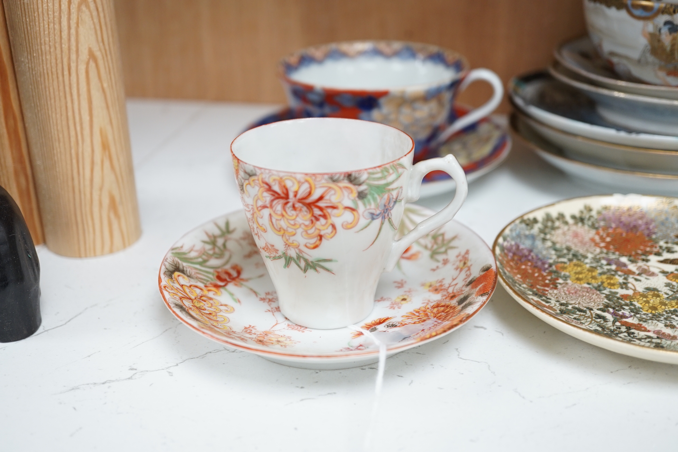 A group of Japanese ceramics, Meiji period and later including satsuma saucers and Imari cup and saucer, largest 17cm in diameter